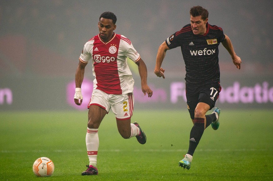 Ajax Amsterdam v Union Berlin - UEFA Europa League Jurrien Timber of Ajax fights for the ball with Kevin Behrens of Union during the UEFA Europa League Play-off, 1st leg match between Ajax Amsterdam a ...