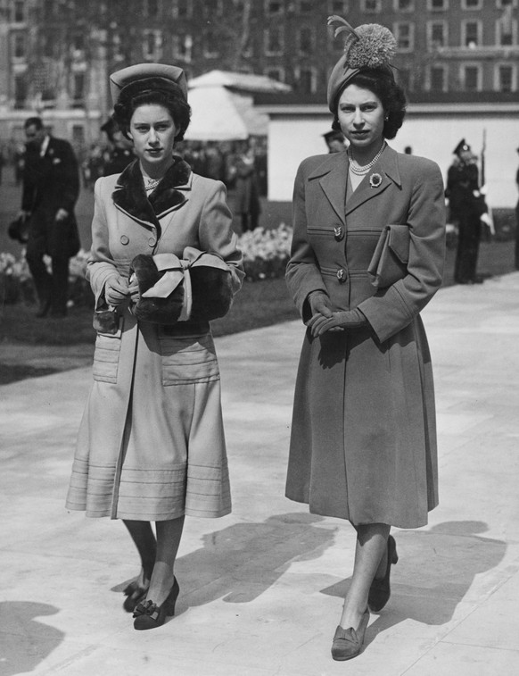 Princess Margaret (1930- 2002, left) and her sister, Princess Elizabeth (later Queen Elizabeth II) leaving Grosvenor Square, London, after the unveiling of the memorial to American President Franklin  ...