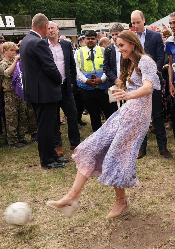 Royal visit to Cambridgeshire. The Duchess of Cambridge kicks a football during a visit to the first ever Cambridgeshire County Day at the July Racecourse, Newmarket, Cambridgeshire. Picture date: Thu ...