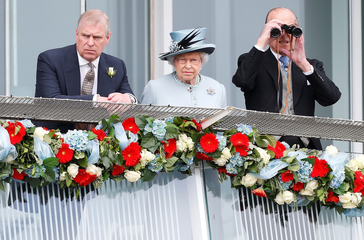 FILE PHOTO: Britain's Queen Elizabeth watches the Epsom Derby with Prince Andrew (L) and Prince Philip, the Duke of Edinburgh, in Epsom, south of London June 1, 2013. REUTERS/Andrew Winning/File ...