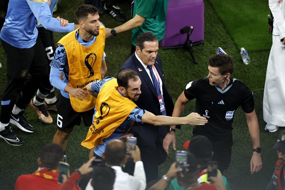 Diego Godn C from Uruguay complains to the German referee Daniel Siebert a FIFA World Cup, WM, Weltmeisterschaft, Fussball soccer match of the group phase between Ghana and Uruguay at Al-Janoub stadiu ...