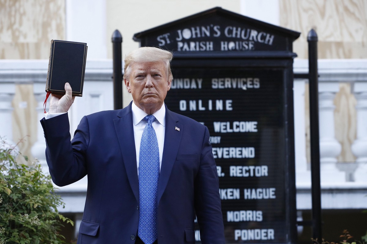 President Donald Trump holds a Bible as he visits outside St. John's Church across Lafayette Park from the White House Monday, June 1, 2020, in Washington. Park of the church was set on fire duri ...