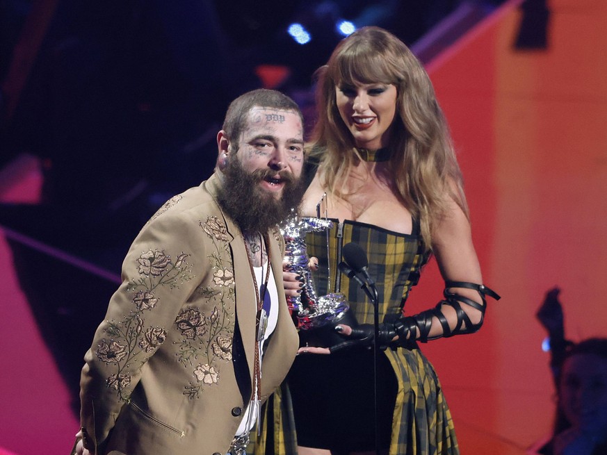 Post Malone and Taylor Swift accept the Best Collaboration award for Fortnight on stage at the 2024 MTV Video Music Awards VMA s at the UBS Arena in Elmont, New York on Wednesday, September 11, 2024.  ...