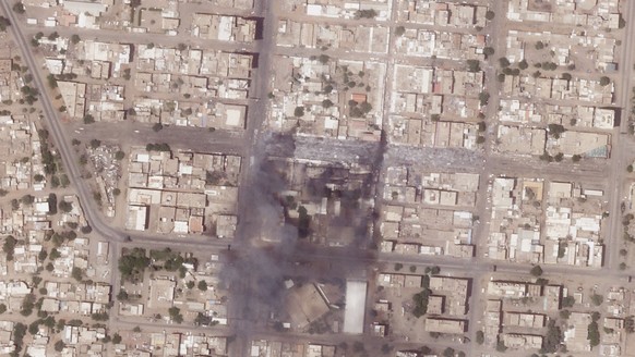 This satellite photo from Planet Labs PBC shows fires and destroyed market stalls in a commercial area of northern Khartoum, Sudan, Tuesday, April 18, 2023. Fighting between forces loyal to dueling ge ...