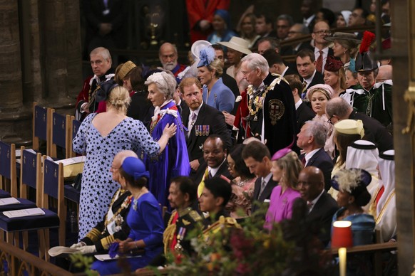 Prince Harry, centre, gestures in Westminster Abbey, ahead of the coronation of King Charles III and Camilla, the Queen Consort, in London, Saturday, May 6, 2023. (Richard Pohle /Pool via AP)