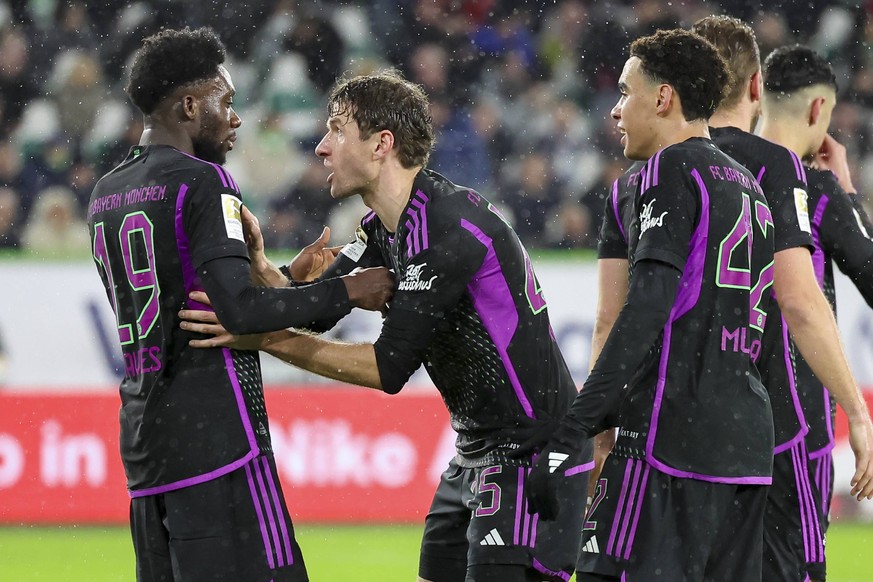 Germany, Wolfsburg, 20.12.2023, Volkswagen Arena, VfL Wolfsburg vs FC Bayern Muenchen - 1. Bundesliga, Jamal Musiala FC Bayern Muenchen celebrates after scoring his teams first goal with Alphonso Davi ...