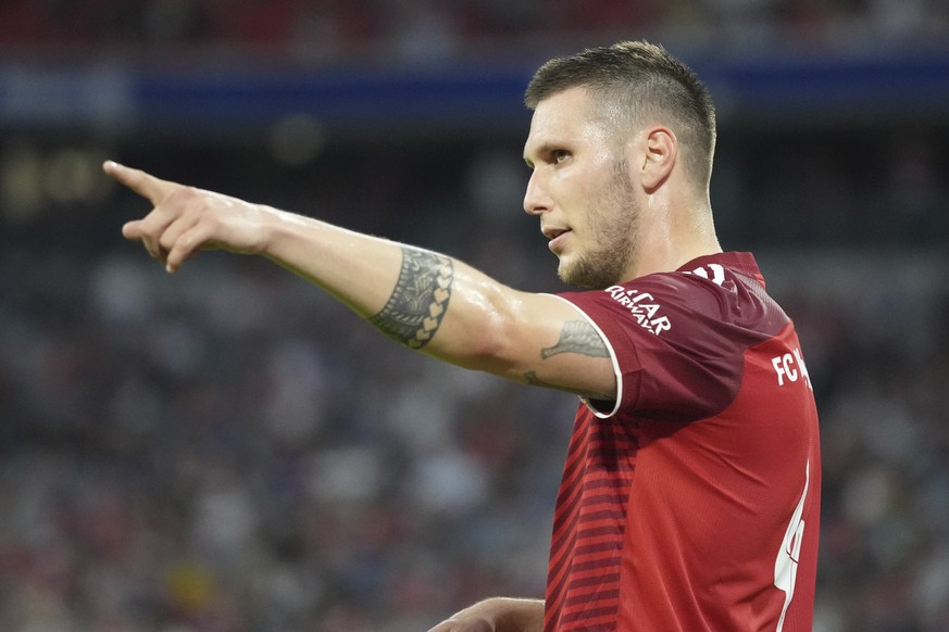 File - Bayern&#039;s Niklas Suele gestures during the German Bundesliga soccer match between Bayern and Eintracht Frankfurt, in Munich, Germany, Sunday, Oct. 3, 2021. Germany defender Niklas Suele is  ...