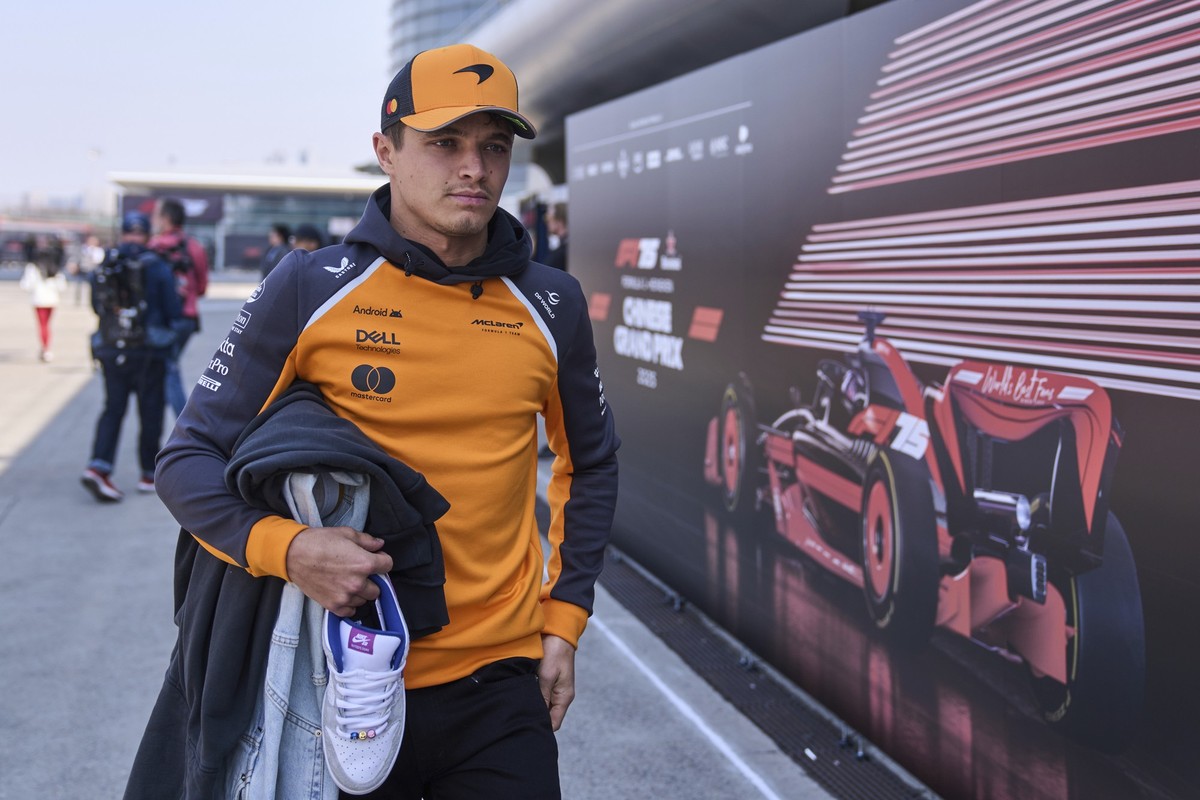 McLaren driver Lando Norris of Britain walks through the paddock at the Shanghai International Circuit ahead of the Chinese Formula One Grand Prix, in Shanghai, China, Thursday, March 20, 2025. (AP Ph ...
