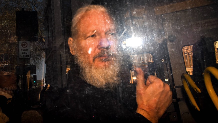 April 11, 2019 - London, England, United Kingdom - Wikileaks founder Julian Assange makes his way into the Westminster Magistrates Court after being arrested this morning by Metropolitan Police, on be ...