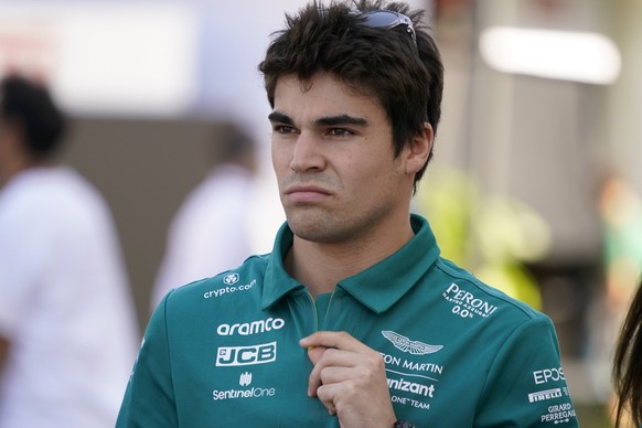 FILE - Aston Martin driver Lance Stroll, of Canada, walks to a news conference at the Formula One U.S. Grand Prix auto race at Circuit of the Americas, on Oct. 20, 2022, in Austin, Texas. Stroll has b ...
