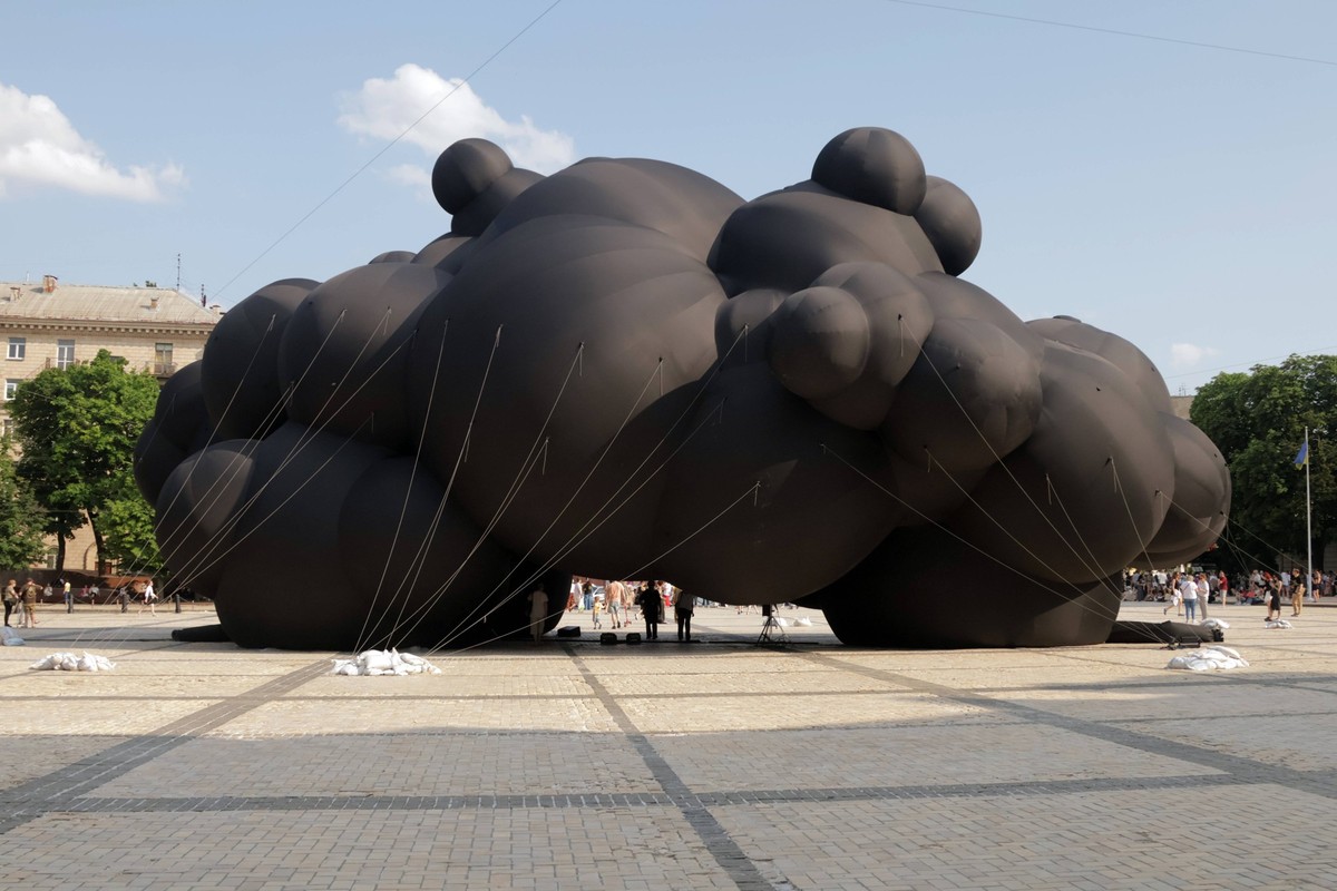 People stand by the Black Cloud installation, which Ukraine will present at the Burning Man independent art festival, on Sofiiska Square, Kyiv, Ukraine, on June 8, 2025 Photo by Yevhen Kotenko/Ukrinfo ...