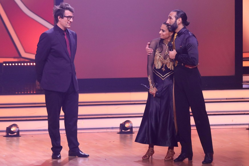 COLOGNE, GERMANY - APRIL 29: Daniel Hartwich, Amira Pocher and Massimo Sinató speak on stage during the 9th show of the 15th season of the television competition show &quot;Let&#039;s Dance&quot; at M ...