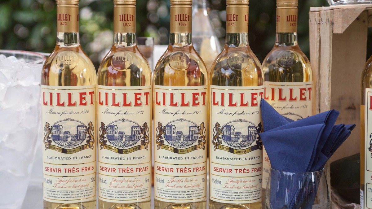 BELGRADE, SERBIA - JULY 12, 2019: Lillet bottles standing on summer bar with its logo Lillet is a French brand of aromatised wines and cocktails from Podensac