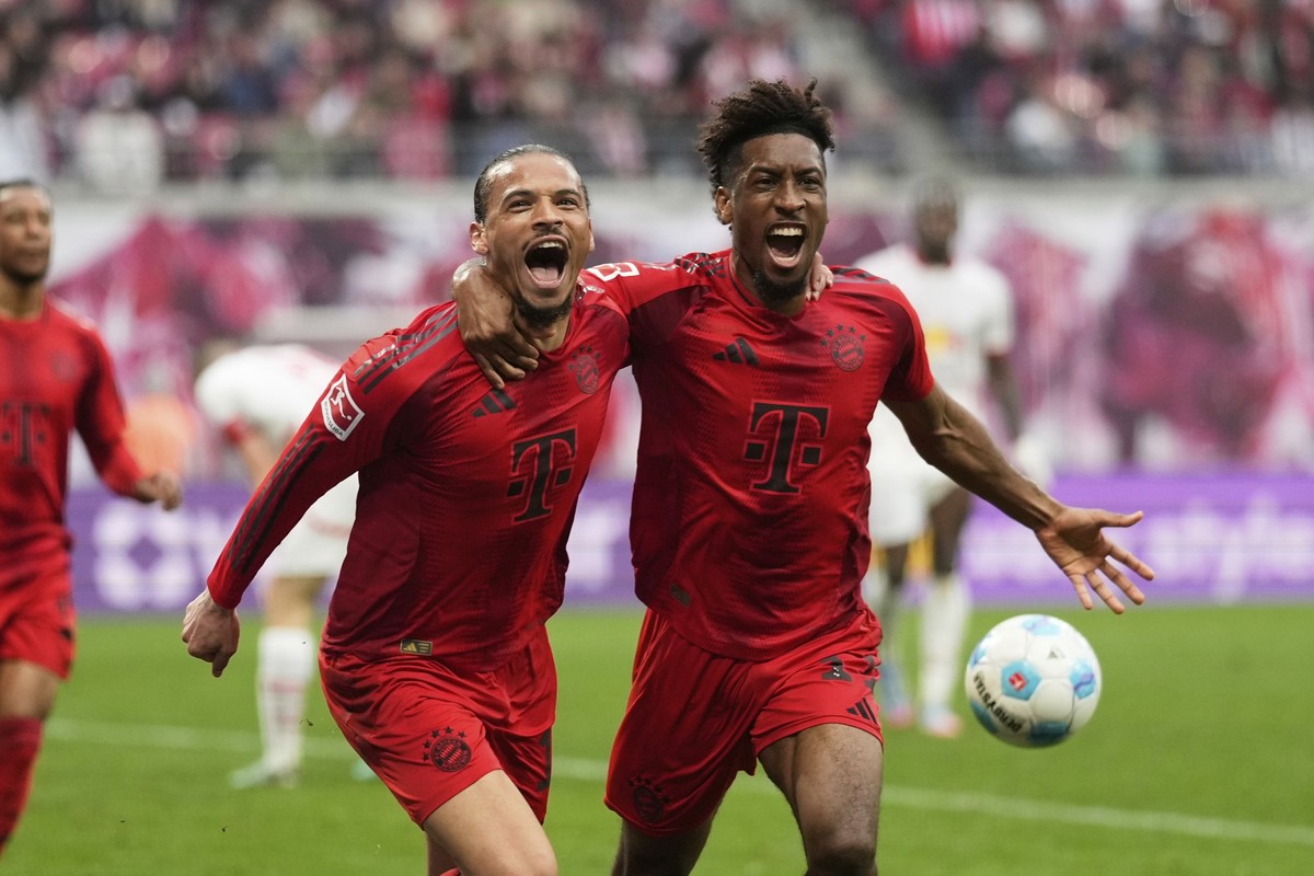 Bayern&#039;s Leroy Sane, left, celebrates with Kingsley Coman, after scoring his side&#039;s third goal during the German Bundesliga soccer match between RB Leipzig and FC Bayern Munich at the Red Bu ...