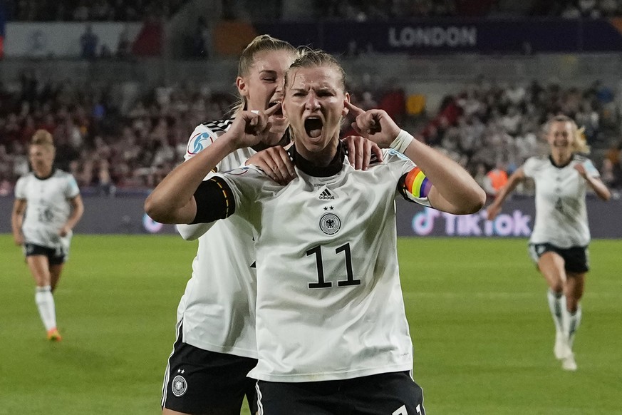 Germany&#039;s Alexandra Popp celebrates with Jule Brand, centre left, after scoring her side&#039;s second goal during the Women Euro 2022 quarter final soccer match between Germany and Austria at Br ...