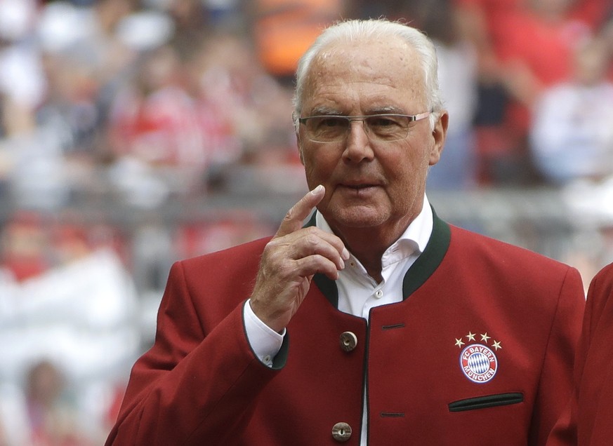 FILE - In this file photo dated Saturday, May 20, 2017, Bayern legend Franz Beckenbauer stands on the pitch prior to the German first division Bundesliga soccer match against SC Freiburg in Munich, Ge ...
