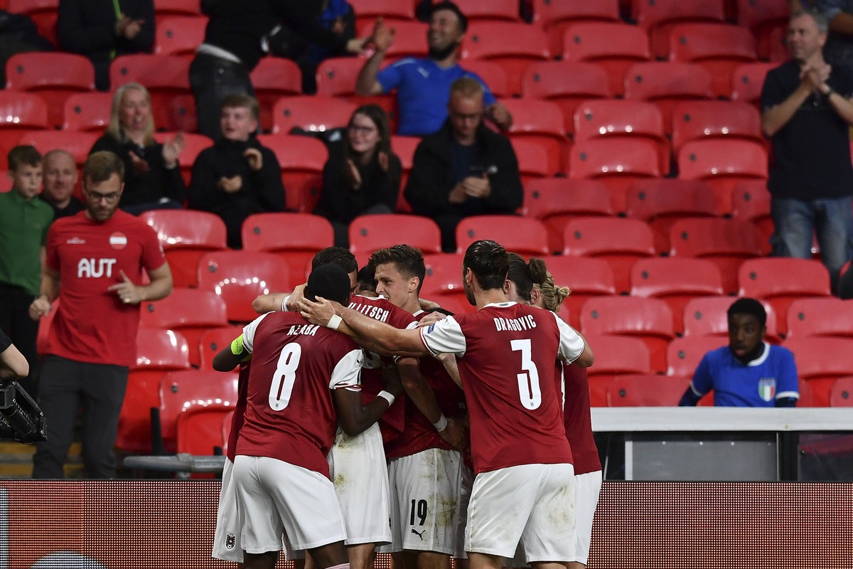 Austria&#039;s Marko Arnautovic celebrates with his teammates after scoring his side&#039;s opening goal that was later disallowed, during the Euro 2020 soccer championship round of 16 match between I ...