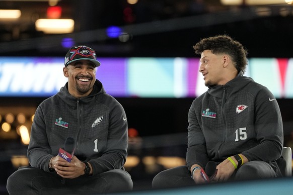 Kansas City Chiefs quarterback Patrick Mahomes, right, and Philadelphia Eagles quarterback Jalen Hurts speak to the media during the NFL football Super Bowl 57 opening night, Monday, Feb. 6, 2023, in  ...