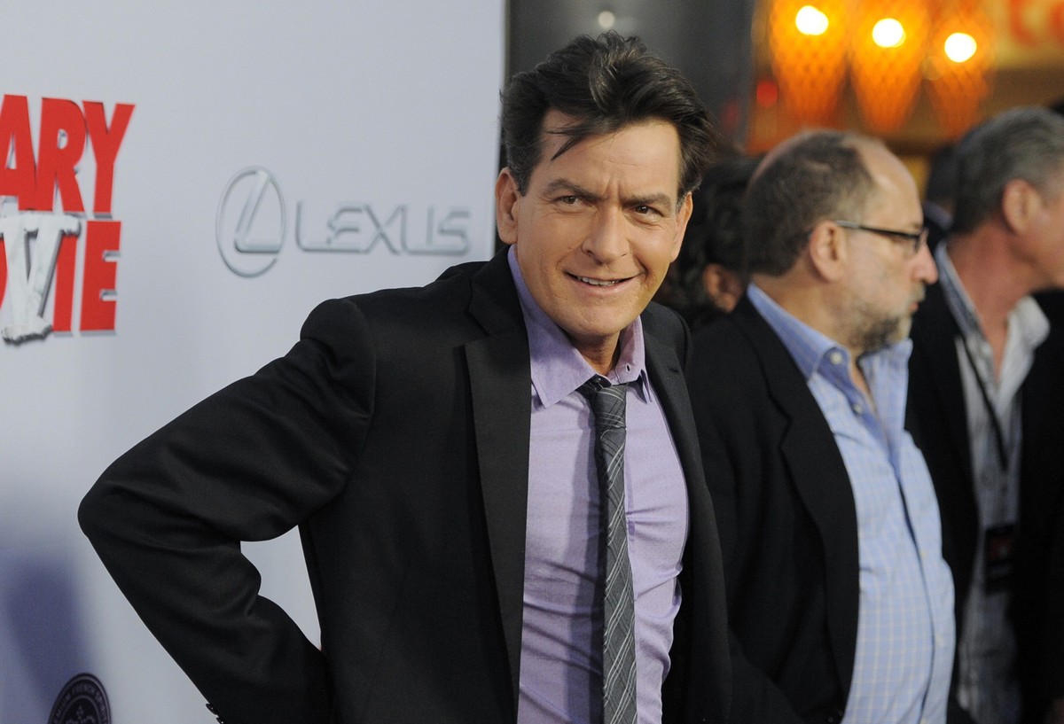 FILE - Charlie Sheen, a cast member in &quot;Scary Movie V,&quot; poses at the premiere of the film on April 11, 2013, in Los Angeles. Sheen’s neighbor was arrested after being accused of assaulting t ...