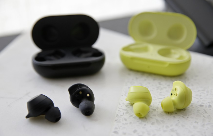 In this Tuesday, Feb. 19, 2019, photo are the new Samsung Galaxy Buds during a product preview in San Francisco. (AP Photo/Eric Risberg)