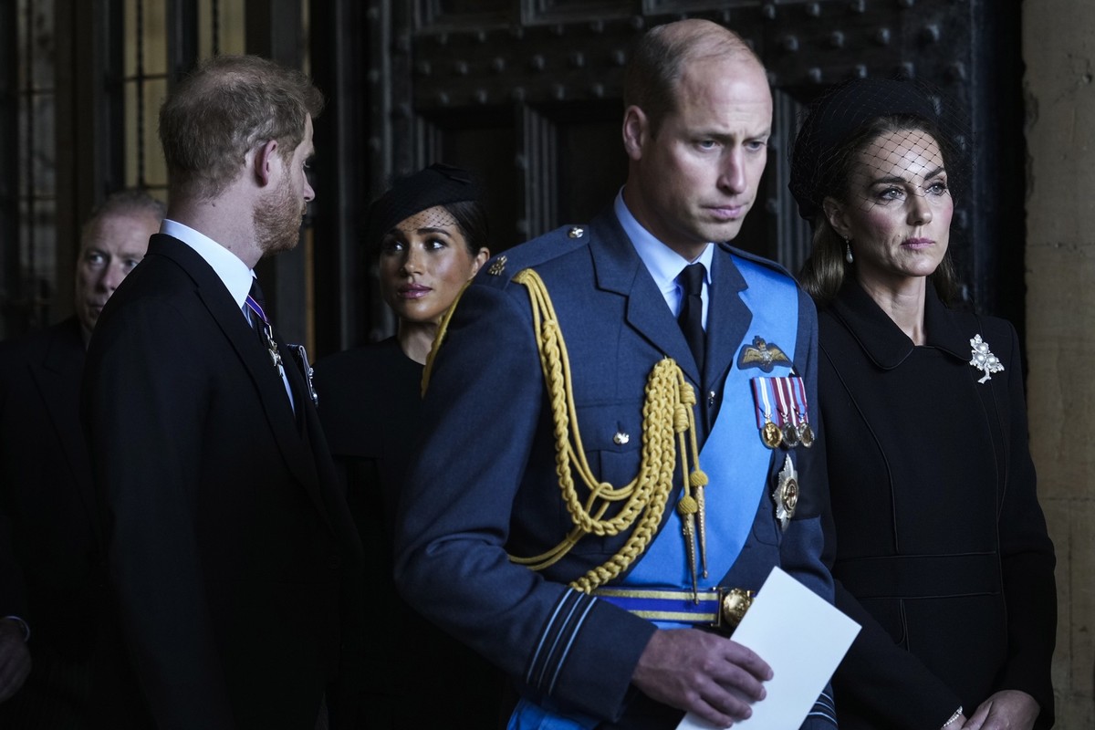 FILE- Britain's Prince William, second right, Kate, Princess of Wales, right, Prince Harry, left, and Meghan, Duchess of Sussex, second left, leave after they paid their respects to Queen Elizabe ...