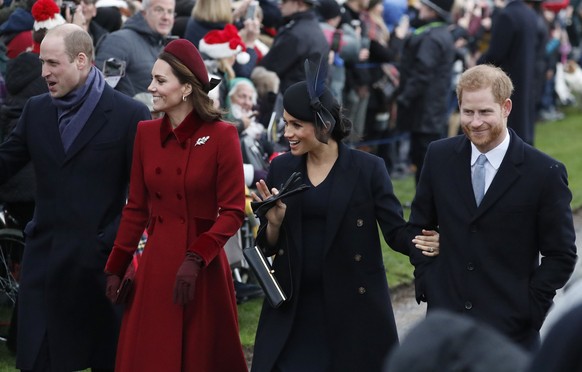 FILE - In this Tuesday, Dec. 25, 2018 file photo, Britain's Prince William, left, Kate, Duchess of Cambridge, second left, Meghan Duchess of Sussex and Prince Harry, right, arrive to attend the Christ ...