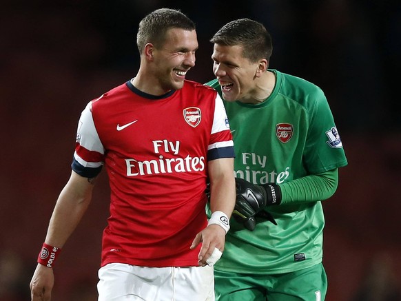 LONDON, April 15, 2014 (Xinhua) -- Lukas Podolski (L) of Arsenal celebrates with goalie Wojciech Szczesny after the Barclays Premier League match between Arsenal and West Ham United at Emirates Stadiu ...
