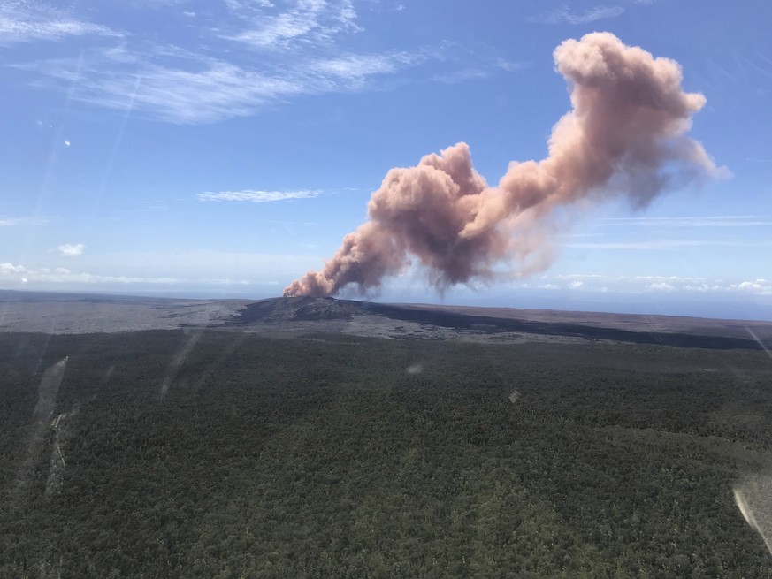 In this photo provided by the U.S. Geological Survey, red ash rises from the Puu Oo vent on Hawaii&#039;s Kilauea Volcano after a magnitude-5.0 earthquake struck the Big Island, Thursday, May 3, 2018  ...
