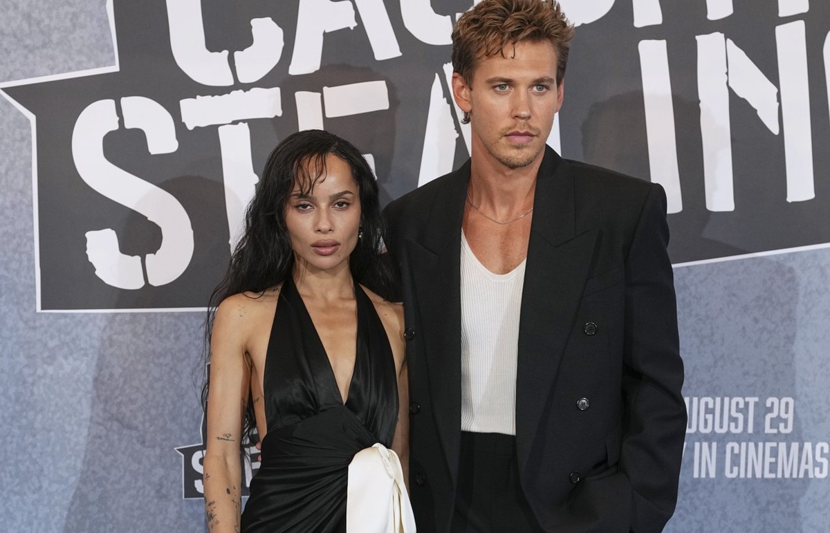 Zoe Kravitz, left, and Austin Butler pose for photographers upon arrival at the screening of the film &#039;Caught Stealing&#039; on Tuesday, Aug. 19, 2025, in London. (Photo by Scott A Garfitt/Invisi ...