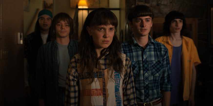 STRANGER THINGS. (L to R) Eduardo Franco as Argyle, Charlie Heaton as Jonathan, Millie Bobby Brown as Eleven, Noah Schnapp as Will Byers, and Finn Wolfhard as Mike Wheeler in STRANGER THINGS. Cr. Cour ...
