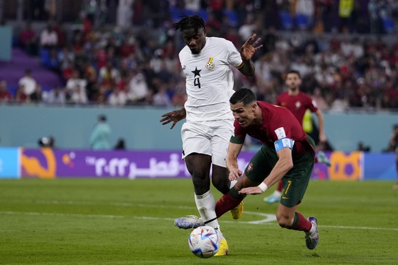 Ghana&#039;s Mohammed Salisu fouls in the penalty box Portugal&#039;s Cristiano Ronaldo during a World Cup group H soccer match at the Stadium 974 in Doha, Qatar, Thursday, Nov. 24, 2022. (AP Photo/Ma ...