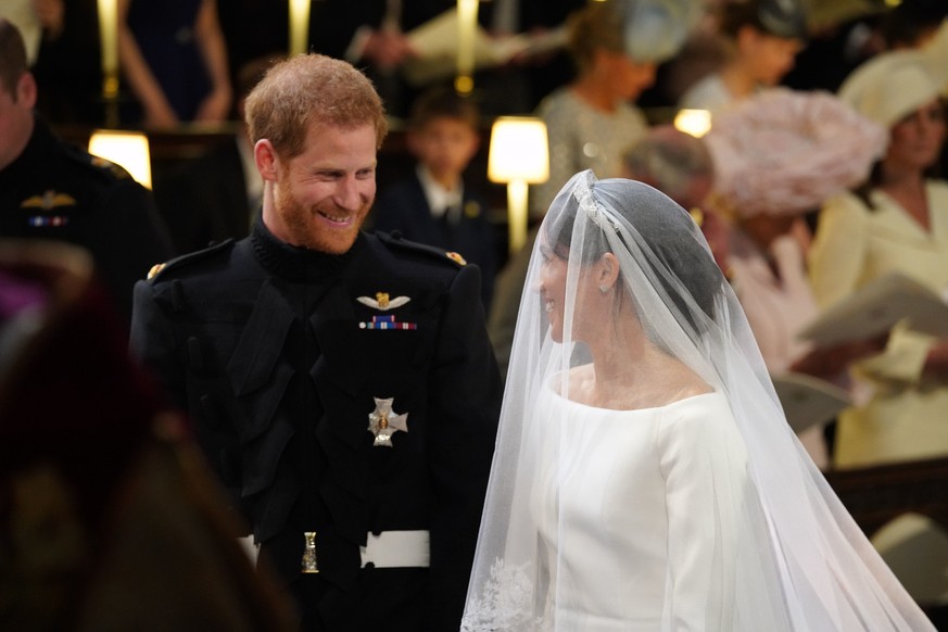 WINDSOR, UNITED KINGDOM - MAY 19: Prince Harry and Meghan Markle stand at the altar during their wedding in St George's Chapel at Windsor Castle on May 19, 2018 in Windsor, England. (Photo by Jonathan ...