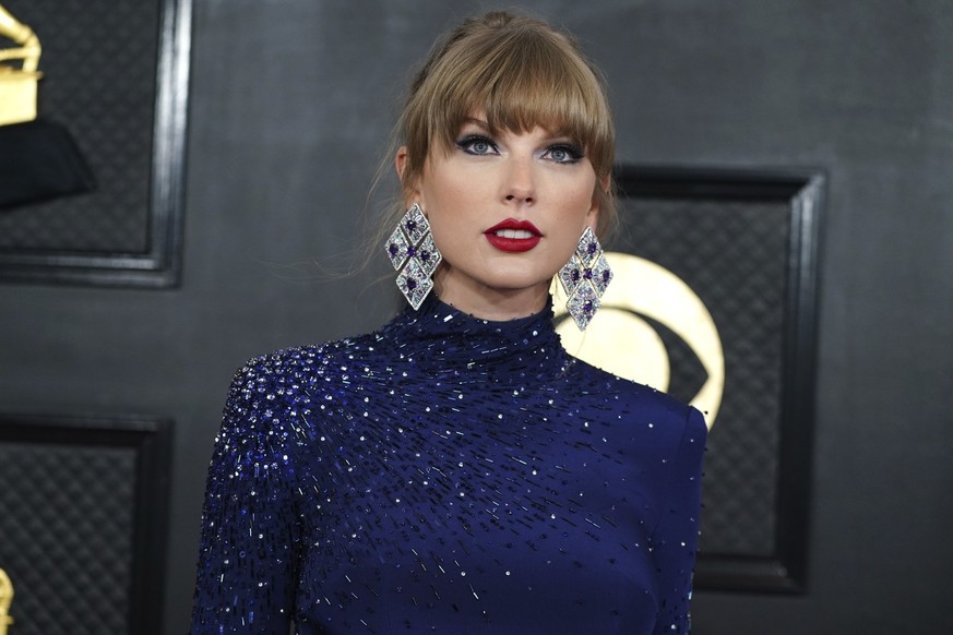 FILE - Taylor Swift arrives at the 65th annual Grammy Awards on Sunday, Feb. 5, 2023, in Los Angeles. A woman who was previously warned to stay away from Swift&#039;s home in Rhode Island was arrested ...