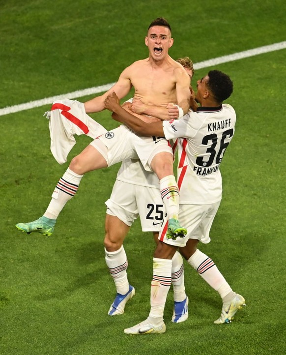 SEVILLE, SPAIN - MAY 18: Rafael Santos Borre of Eintracht Frankfurt celebrates with teammates scoring their sides winning penalty in the penalty shoot out during the UEFA Europa League final match bet ...