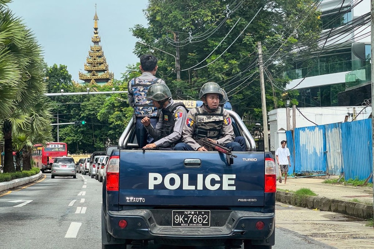 Police patrol on a street in Yangon on July 19, 2023, on the 76th Martyrs' Day, which marks the anniversary of the assassination of independence leaders including general Aung San, father of the ...
