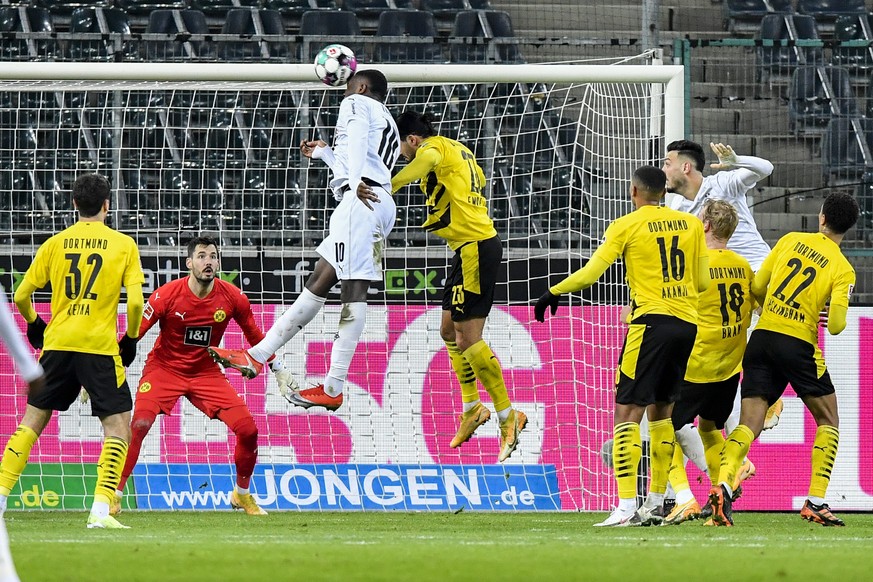 Moenchengladbach&#039;s Marcus Thuram scores during the German Bundesliga soccer match between Borussia Moenchengladbach and Borussia Dortmund in Moenchengladbach, Germany, Friday, Jan. 22, 2021. (AP  ...