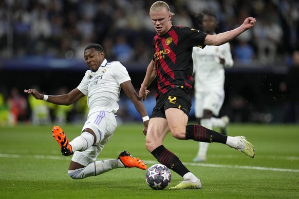Real Madrid&#039;s David Alaba slides in to block a shot by Manchester City&#039;s Erling Haaland during the Champions League semifinal first leg soccer match between Real Madrid and Manchester City a ...
