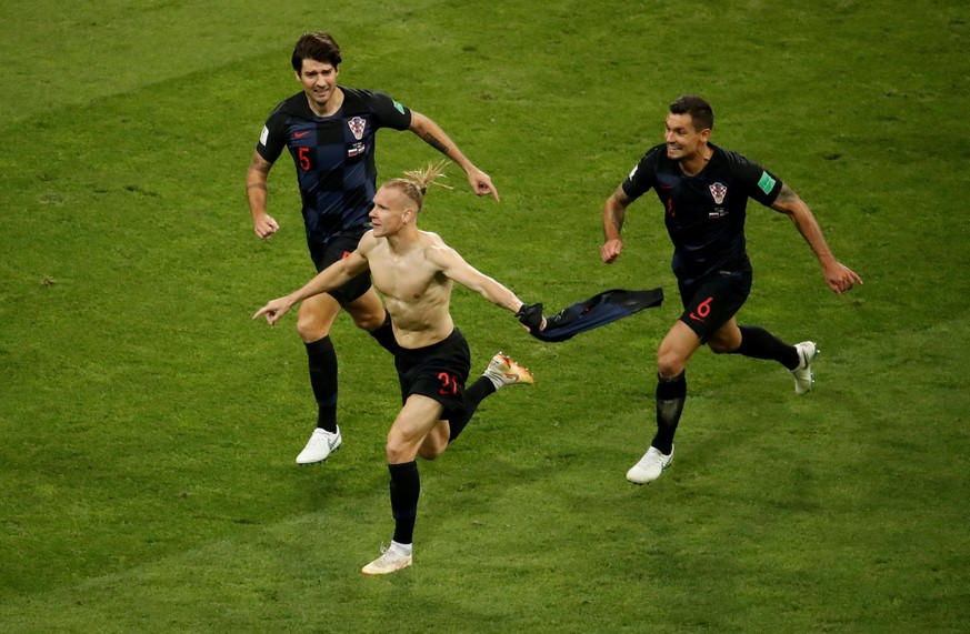 FILE PHOTO: Soccer Football - World Cup - Quarter Final - Russia vs Croatia - Fisht Stadium, Sochi, Russia - July 7, 2018 Croatia's Domagoj Vida celebrates their second goal with Vedran Corluka a ...