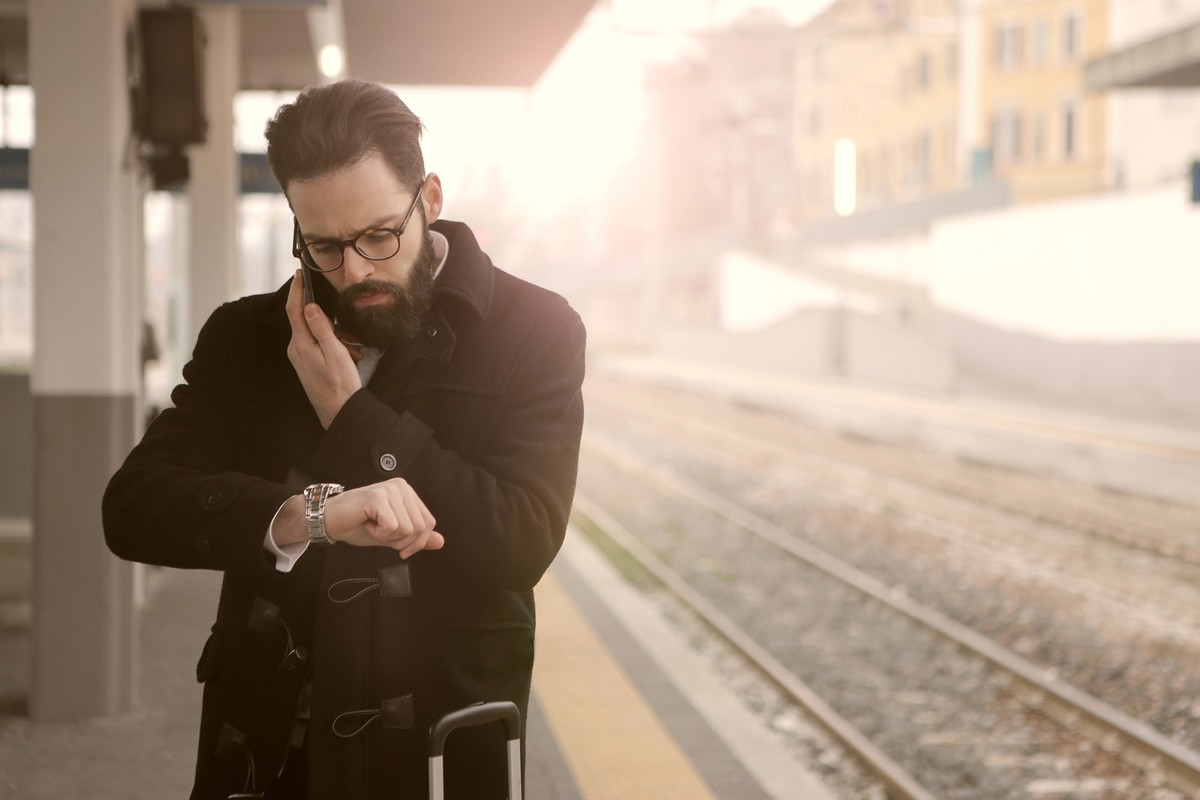 Young man is checking the time