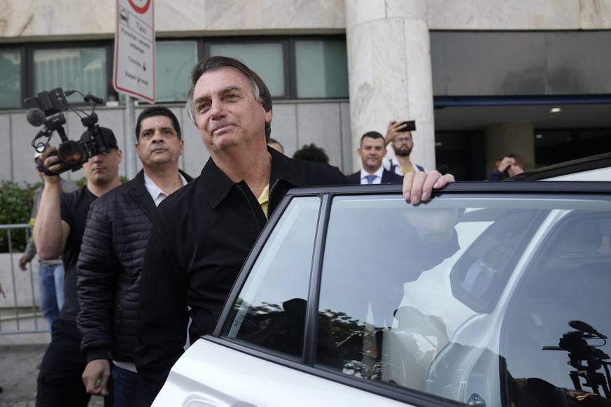 Brazil&#039;s former President Jair Bolsonaro gets into a car after landing at the airport in Rio de Janeiro, Brazil, Thursday, June 29, 2023. Bolsonaro is being judged by Supreme Electoral Court judg ...