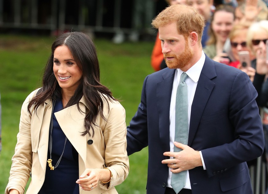 MELBOURNE, AUSTRALIA - OCTOBER 18: Prince Harry, Duke of Sussex and Meghan, Duchess of Sussex meet members of the public before attending an official reception at Government House on October 18, 2018  ...