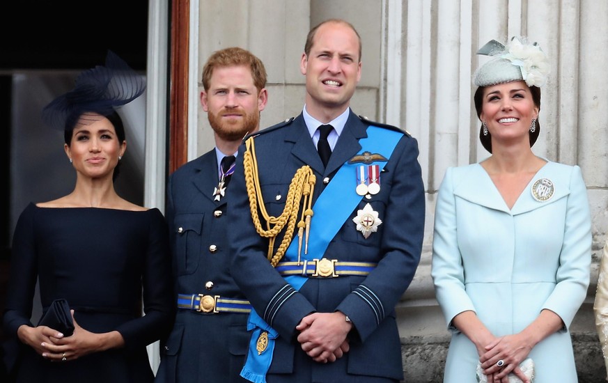 LONDON, ENGLAND - JULY 10: (L-R) Meghan, Duchess of Sussex, Prince Harry, Duke of Sussex, Prince William, Duke of Cambridge and Catherine, Duchess of Cambridge watch the RAF flypast on the balcony of  ...