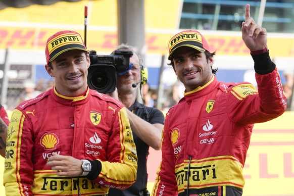 Ferrari driver Carlos Sainz of Spain, right, celebrates his pole position with third placed Ferrari driver Charles Leclerc of Monaco after the qualifying session ahead of Sunday&#039;s Formula One Ita ...