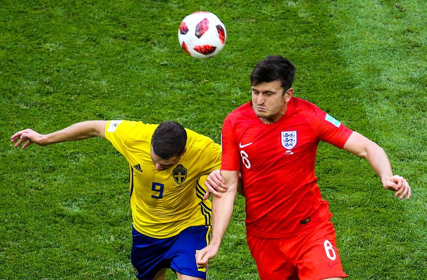 SAMARA, RUSSIA - JULY 7, 2018: Sweden s Marcus Berg (L) and England s Harry Maguire fight for the ball in their 2018 FIFA World Cup WM Weltmeisterschaft Fussball Quarterfinal match at Samara Arena Sta ...