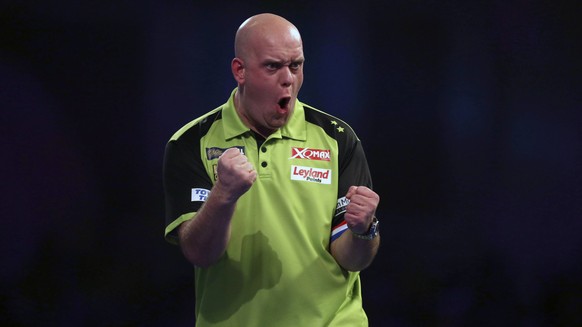 Michael van Gerwen of the Netherlands celebrates during his match against Britain&#039;s Gary Anderson on day fifteen of the World Darts Championships at Alexandra Palace, London, Sunday, Dec. 30, 201 ...