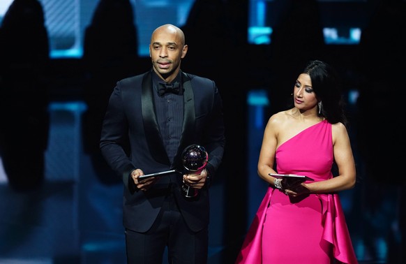 The Best FIFA Football Awards 2023 - Eventim Apollo Thierry Henry and Reshmin Chowdhury on stage after collecting The Best FIFA Men s Player award on behalf of Lionel Messi during The Best FIFA Footba ...